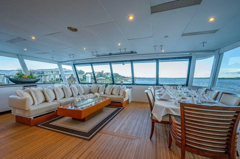 Slide: The Image of Luxurious 2000 Christensen Raised Pilothouse yacht interior with elegant dining and seating area. - 1