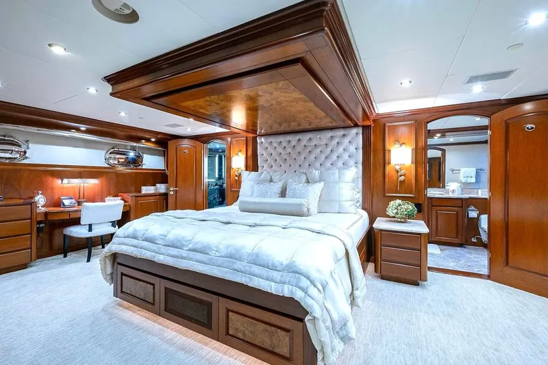 Slide: The Image of Luxurious bedroom interior on 2000 Christensen Raised Pilothouse yacht with elegant wood finishes. - 15