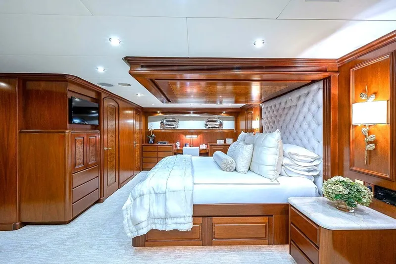 Slide: The Image of Luxurious bedroom interior on 2000 Christensen Raised Pilothouse yacht with elegant wood paneling. - 16