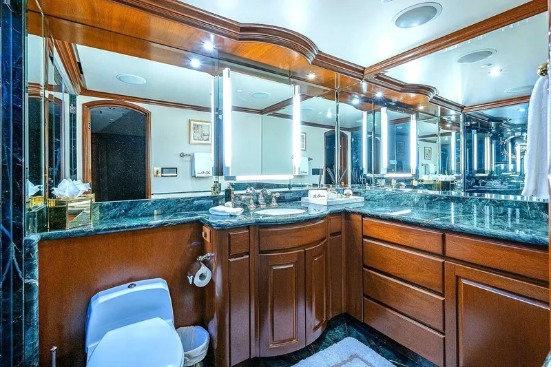 Slide: The Image of Luxurious bathroom in 2000 Christensen Raised Pilothouse yacht with elegant wood cabinetry and marble countertops. - 17