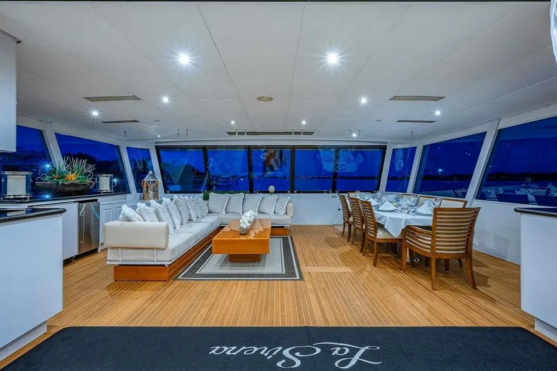 Slide: The Image of Luxurious interior of 2000 Christensen Raised Pilothouse yacht with elegant seating and dining area. - 2