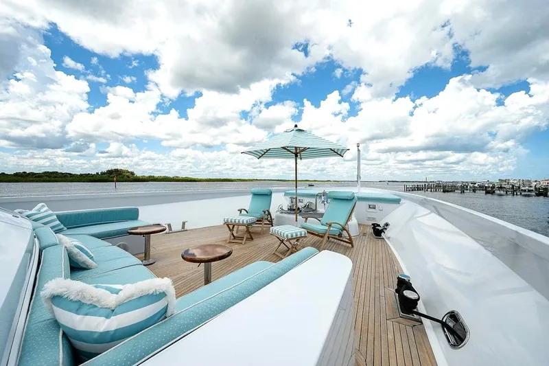 Slide: The Image of Luxurious deck of 2000 Christensen Raised Pilothouse yacht with seating and umbrella. - 31