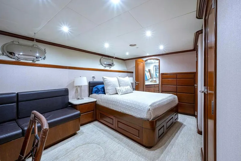 Slide: The Image of Luxurious bedroom interior on 2000 Christensen Raised Pilothouse yacht, featuring elegant wood finishes. - 33