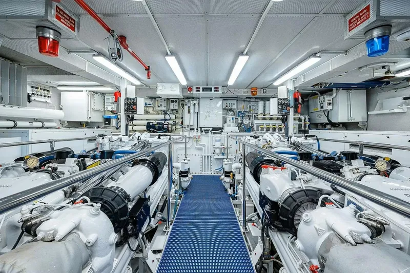Slide: The Image of Engine room of a 2000 Christensen Raised Pilothouse yacht, featuring advanced machinery and equipment. - 34