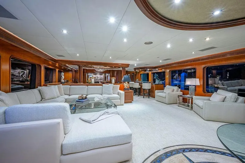 Slide: The Image of Luxurious interior of 2000 Christensen Raised Pilothouse yacht with elegant seating and ambient lighting. - 6