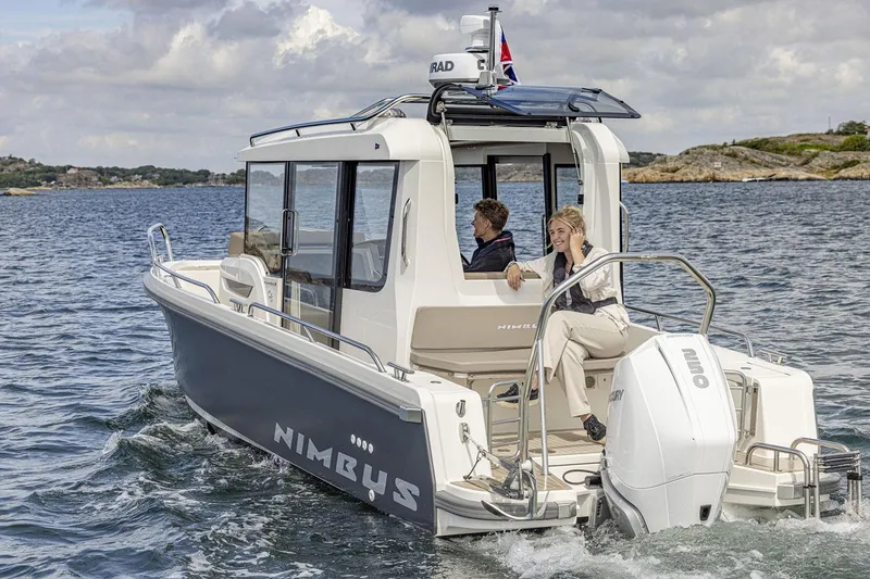 Slide: The Image of Manufacturer Provided Image: Nimbus Commuter 8 boat 2026 on water with two people. - 2