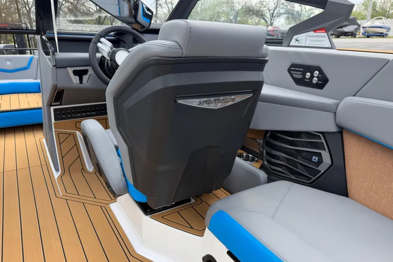 Slide: The Image of 2026 Nautique Super Air Nautique G25 interior with modern seating and steering wheel. - 20