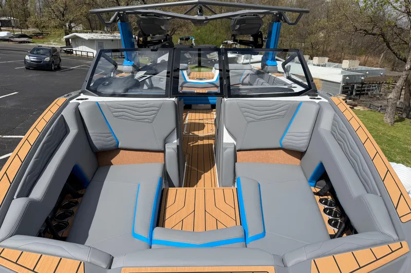 Slide: The Image of 2026 Nautique Super Air Nautique G25 boat interior with gray and blue seating. - 14