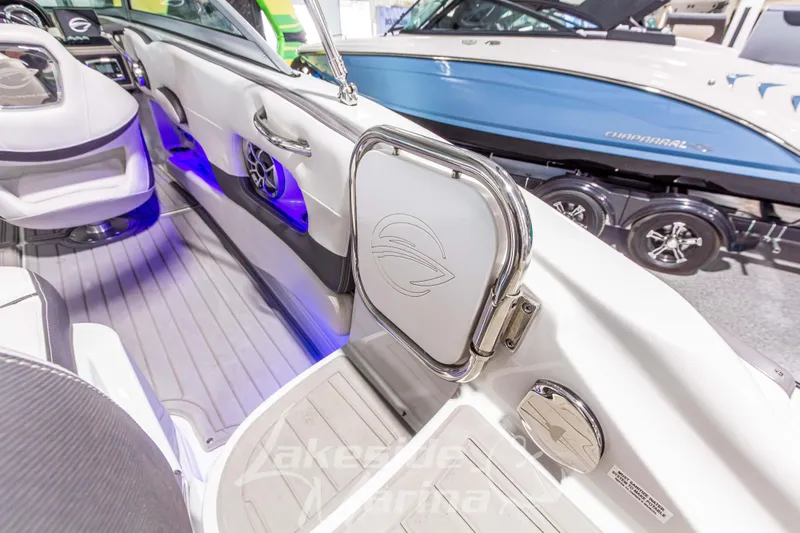 Slide: The Image of 2017 Crownline Eclipse E1 XS boat interior with modern design and blue LED lighting. - 12