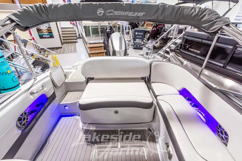 Slide: The Image of 2017 Crownline Eclipse E1 XS boat interior with white seating and blue LED lighting. - 15