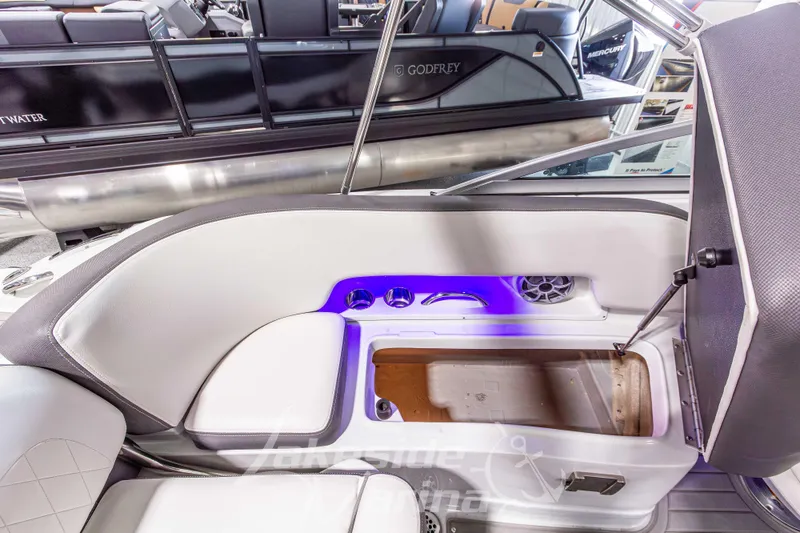 Slide: The Image of 2017 Crownline Eclipse E1 XS boat interior with storage compartment and seating. - 16