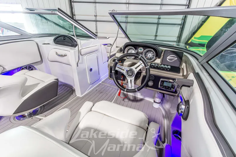 Slide: The Image of 2017 Crownline Eclipse E1 XS boat interior with modern dashboard and steering wheel. - 19