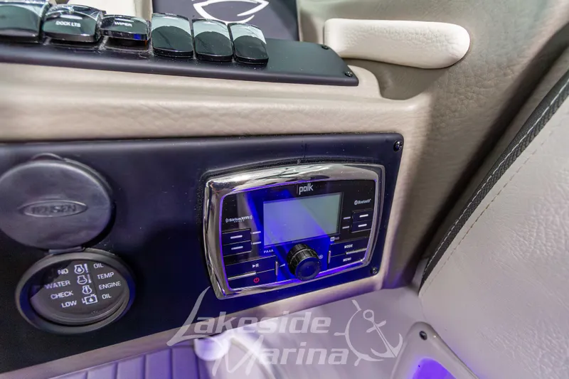 Slide: The Image of 2017 Crownline Eclipse E1 XS dashboard with Polk audio system and control panel. - 23