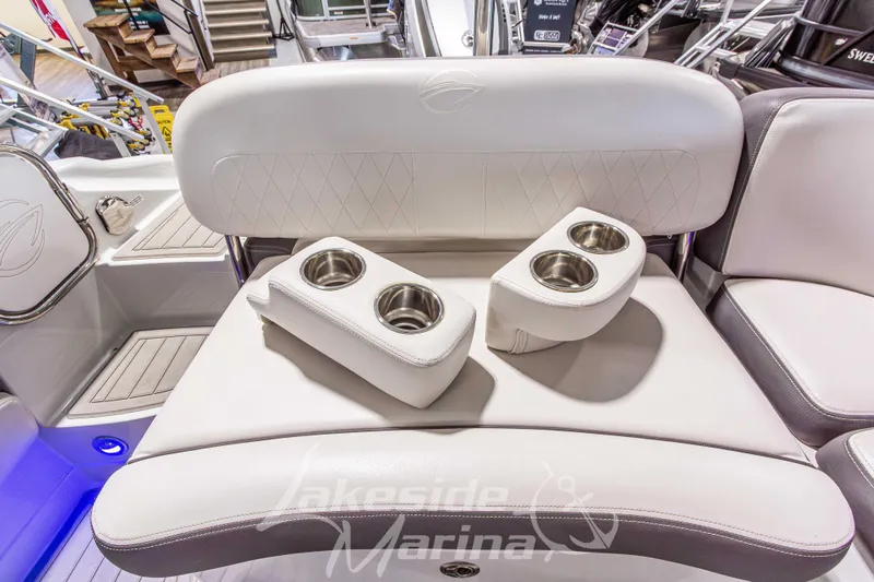 Slide: The Image of 2017 Crownline Eclipse E1 XS boat interior with white seating and cup holders. - 27