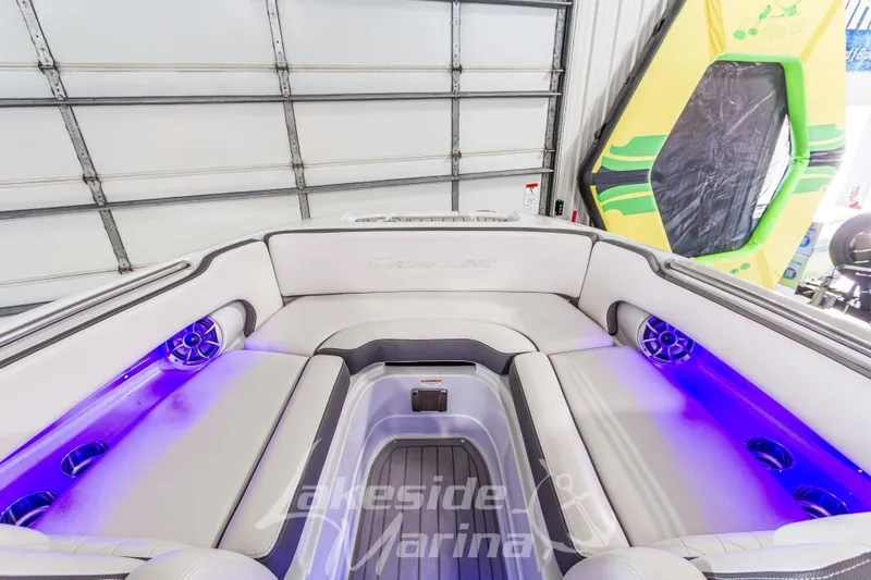 Slide: The Image of 2017 Crownline Eclipse E1 XS boat interior with blue LED lighting and cushioned seating. - 28