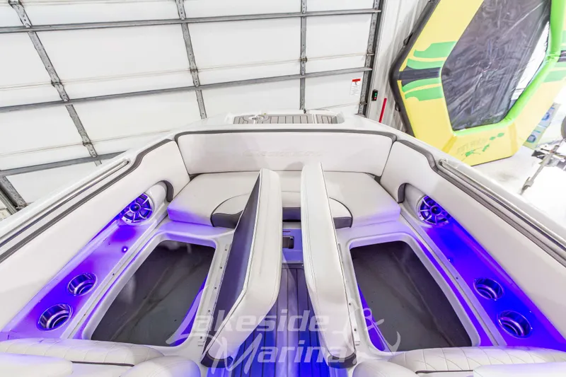 Slide: The Image of 2017 Crownline Eclipse E1 XS boat interior with blue LED lighting and cushioned seating. - 29