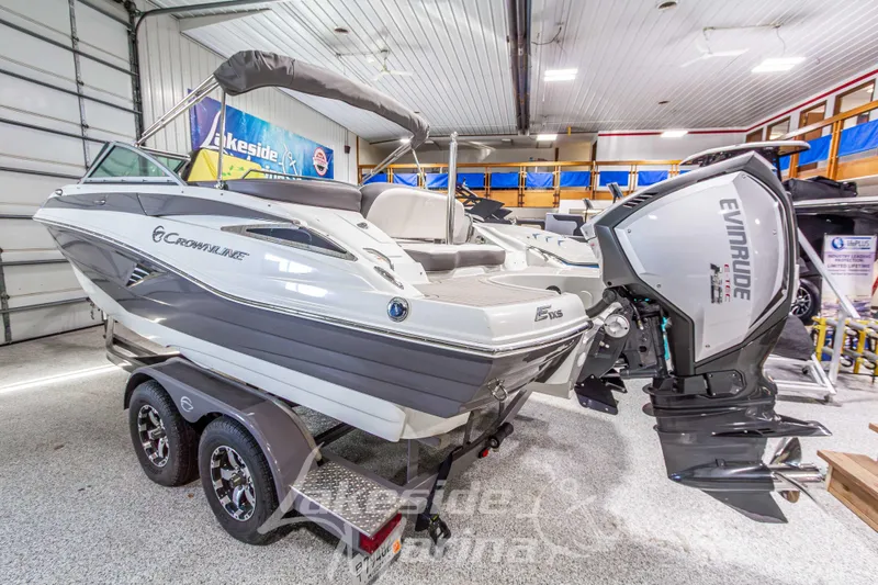 Slide: The Image of 2017 Crownline Eclipse E1 XS boat with Evinrude engine in showroom. - 3
