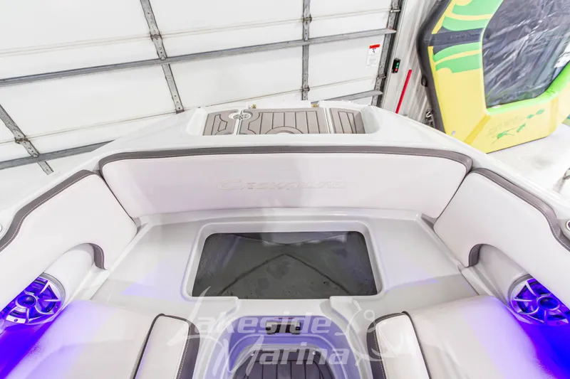 Slide: The Image of 2017 Crownline Eclipse E1 XS boat interior with white seating and blue LED lighting. - 33