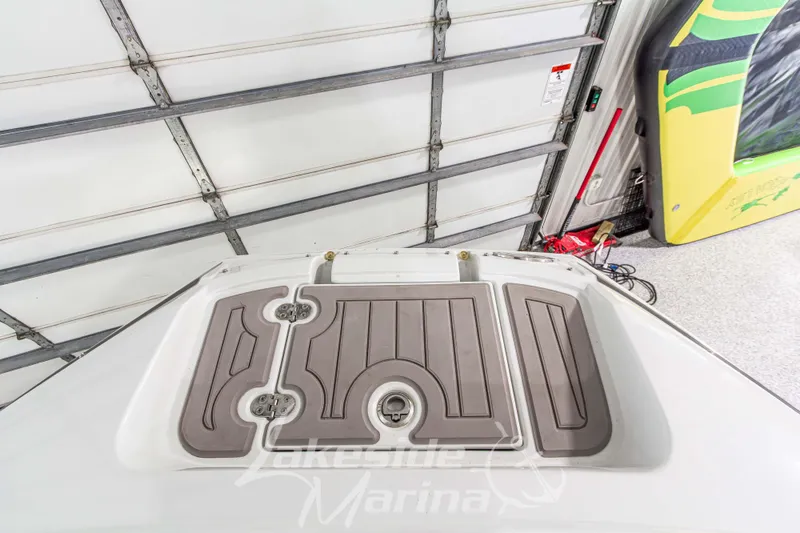 Slide: The Image of 2017 Crownline Eclipse E1 XS boat deck in a garage setting. - 34