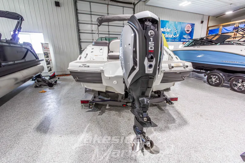 Slide: The Image of 2017 Crownline Eclipse E1 XS boat with 150 HP outboard motor in showroom. - 4