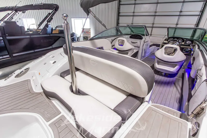 Slide: The Image of 2017 Crownline Eclipse E1 XS boat interior with modern seating and dashboard. - 8