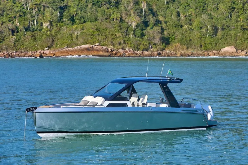 The Image of Schaefer V34 2027 yacht on calm water near forested coastline. - 0