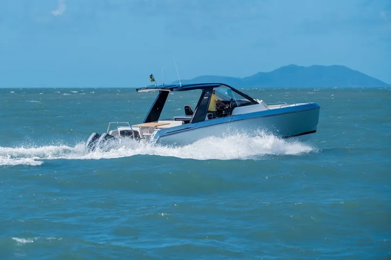 Slide: The Image of Schaefer V34 2027 motorboat cruising on open sea. - 12