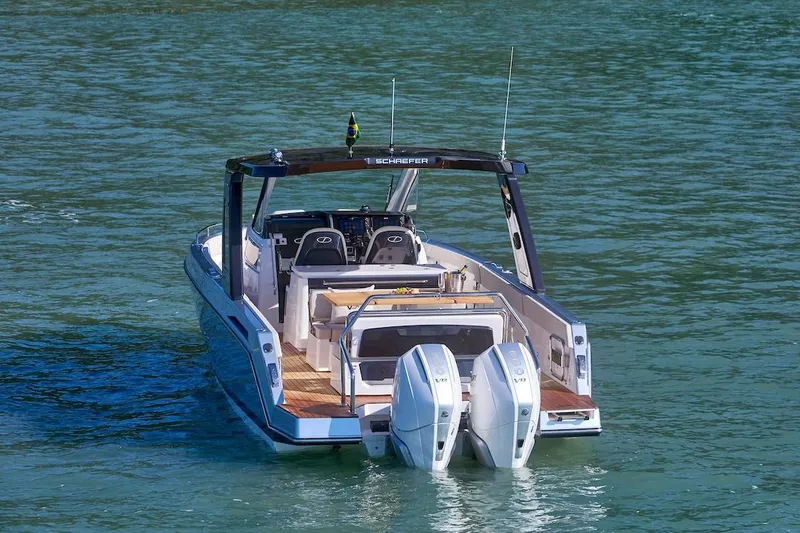 Slide: The Image of Schaefer V34 2027 motorboat on calm water. - 4
