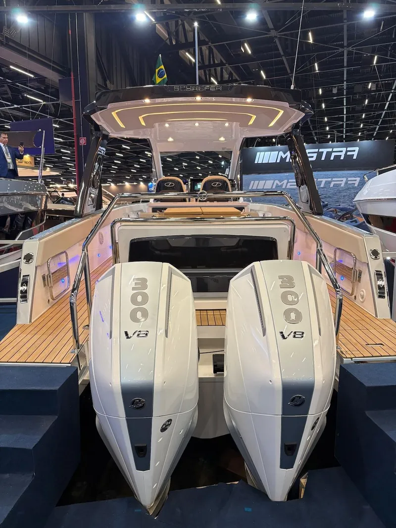 Slide: The Image of Schaefer V34 2027 with twin 300 V8 engines at a boat show. - 6