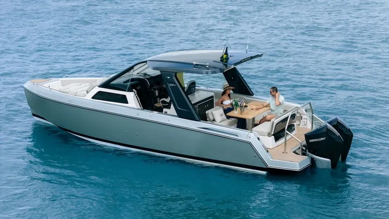 Slide: The Image of Schaefer V34 2027 motorboat on open sea with two people. - 7