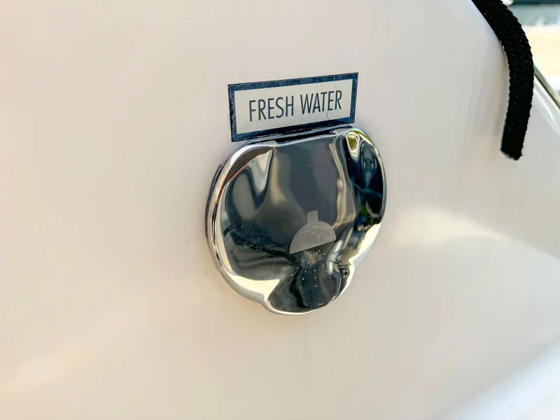 Slide: The Image of Fresh water access on 2014 Pursuit ST 310 Sport boat. - 24