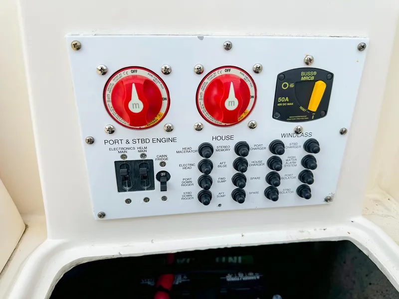 Slide: The Image of Control panel of a 2014 Pursuit ST 310 Sport boat with switches and dials. - 28