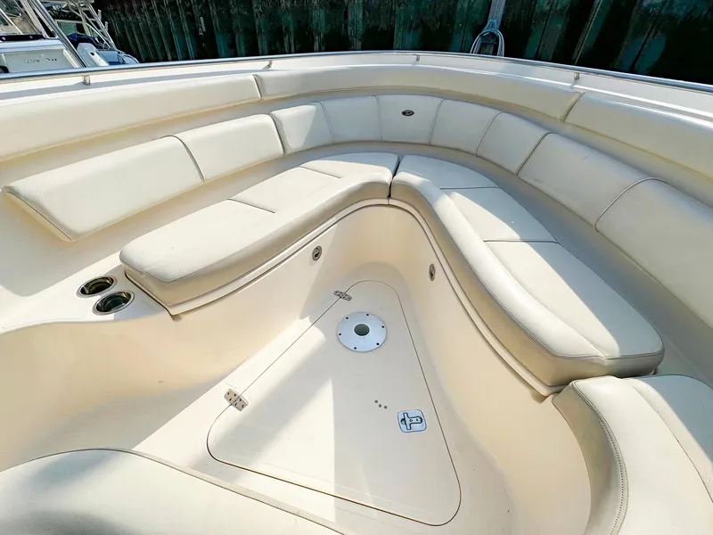 Slide: The Image of 2014 Pursuit ST 310 Sport boat interior with cushioned seating. - 30