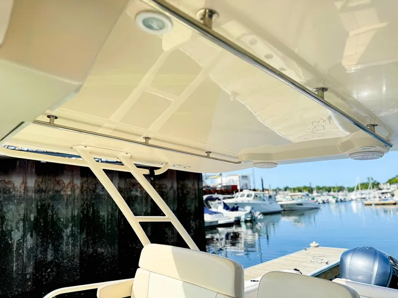 Slide: The Image of 2014 Pursuit ST 310 Sport boat interior with marina view. - 39
