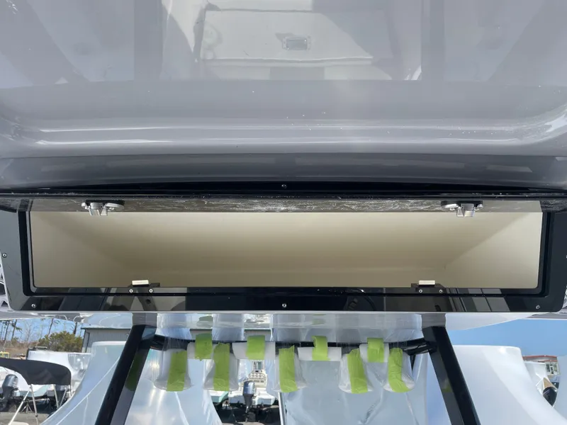 Slide: The Image of Key West 260 CC 2026, open storage compartment on a boat. - 11