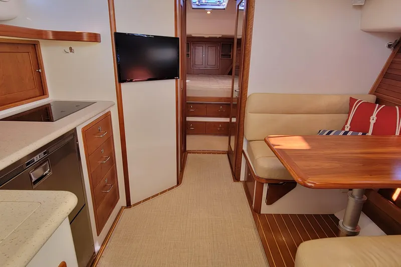 Slide: The Image of Luxurious interior of 2017 MJM 40z Downeast yacht with modern kitchen and cozy seating area. - 17