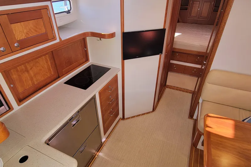 Slide: The Image of 2017 MJM 40z Downeast yacht interior with modern kitchen and cozy cabin. - 18