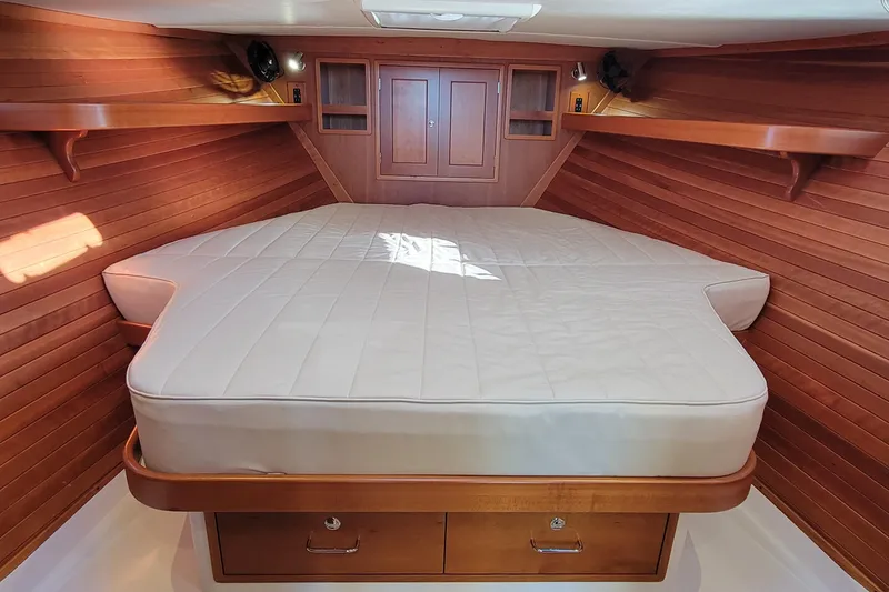 Slide: The Image of 2017 MJM 40z Downeast cabin with wooden interior and spacious bed. - 22