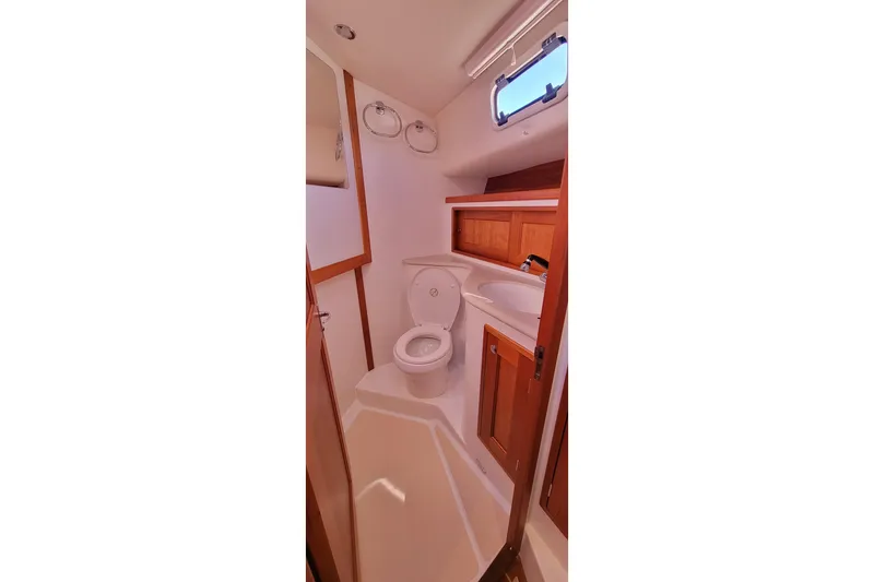 Slide: The Image of 2017 MJM 40z Downeast yacht bathroom with wooden cabinets and compact design. - 25