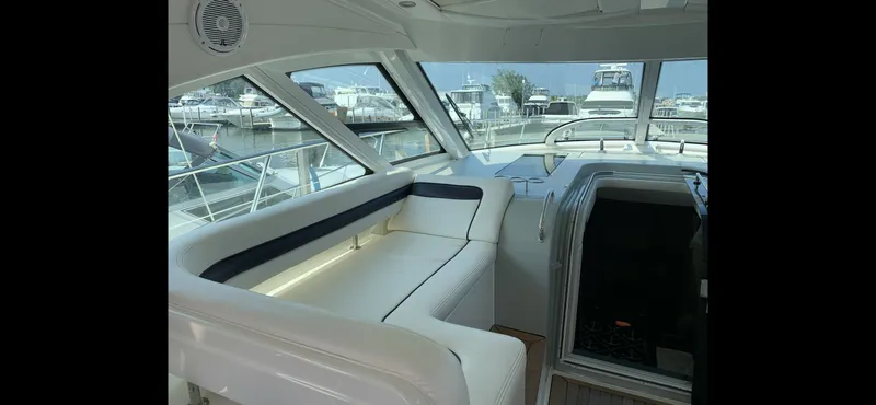 Slide: The Image of Interior of a 2010 Sea Ray 470 Sundancer yacht at the marina. - 15