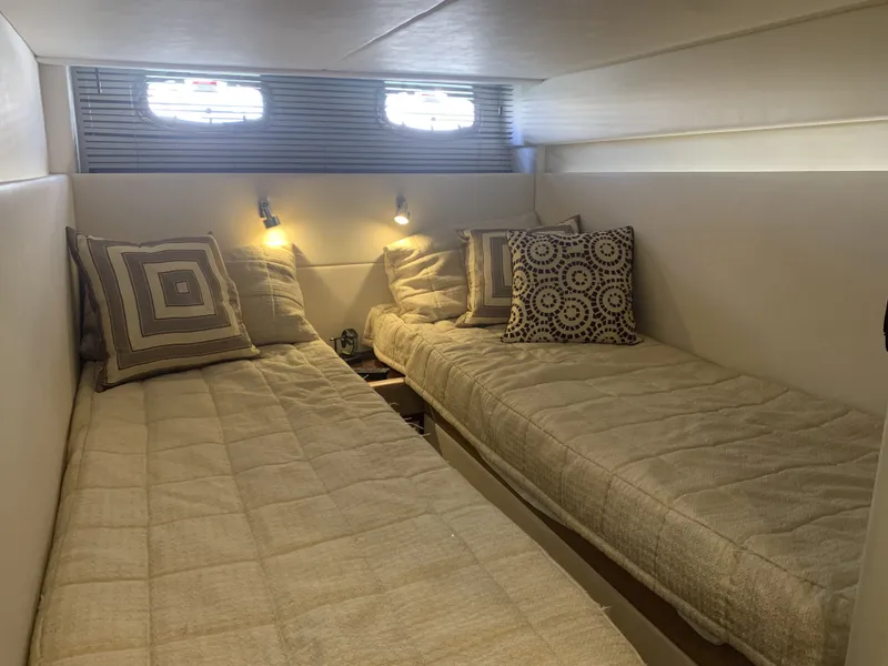 Slide: The Image of Interior of 2010 Sea Ray 470 Sundancer with twin beds. - 25