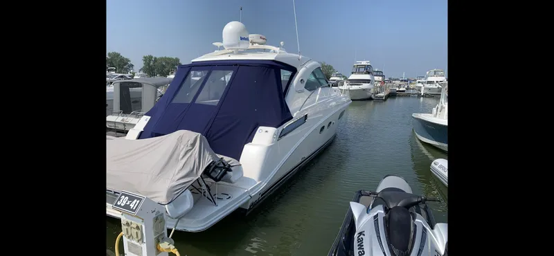 Slide: The Image of 2010 Sea Ray 470 Sundancer docked in a marina. - 3