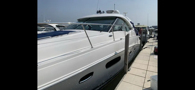 Slide: The Image of 2010 Sea Ray 470 Sundancer yacht docked at marina. - 4