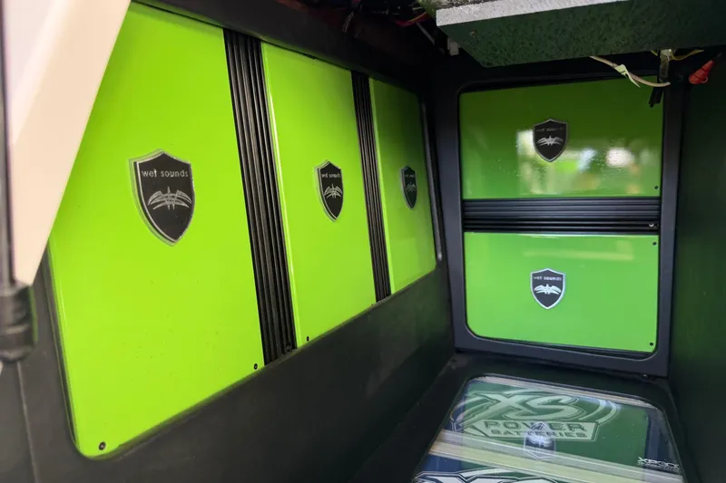 Slide: The Image of Green audio system in 2014 Nautique Super Air Nautique G23 boat with Wet Sounds branding. - 14