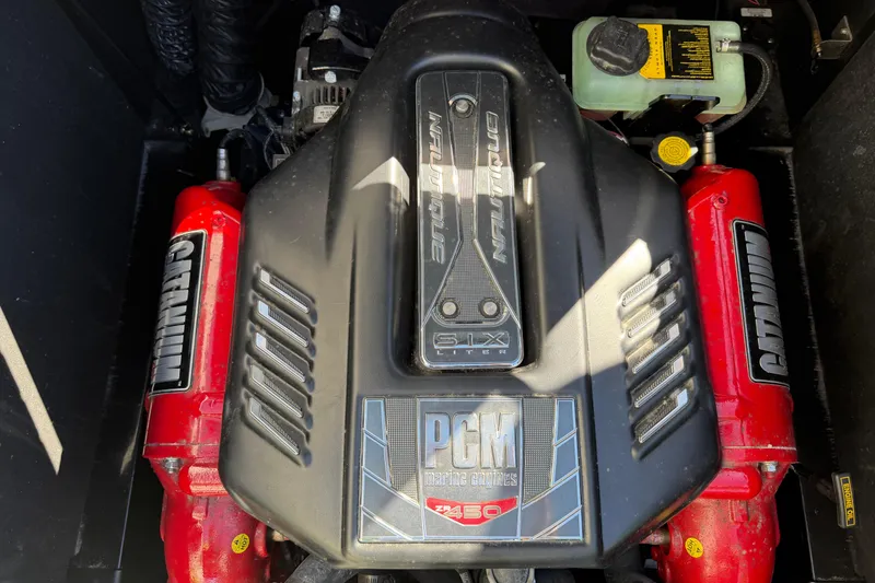 Slide: The Image of 2014 Nautique Super Air Nautique G23 engine, PCM 450, with red components. - 19