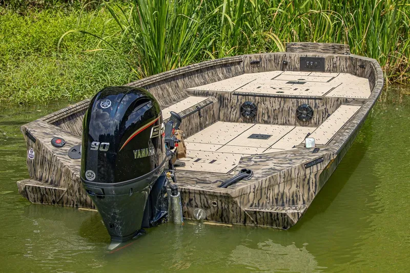 Slide: The Image of Manufacturer Provided Image: 2026 Excel Tomahawk boat with Yamaha engine in a lush, green water setting. - 7