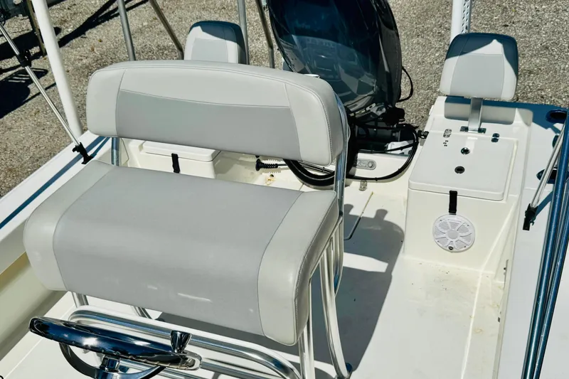 Slide: The Image of 2023 KenCraft 219 Bay Rider boat interior with seating and controls. - 11