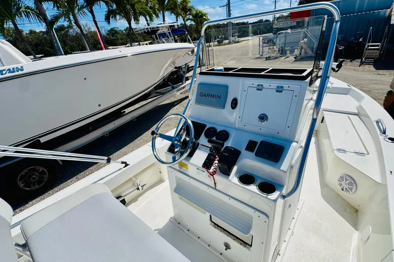 Slide: The Image of 2023 KenCraft 219 Bay Rider boat interior with Garmin navigation system and steering console. - 12
