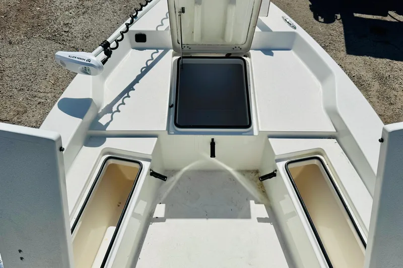 Slide: The Image of 2023 KenCraft 219 Bay Rider boat deck with open storage compartments. - 15