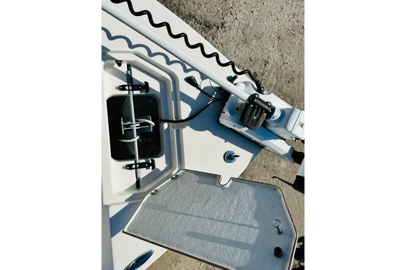 Slide: The Image of 2023 KenCraft 219 Bay Rider boat anchor compartment and trolling motor detail. - 16